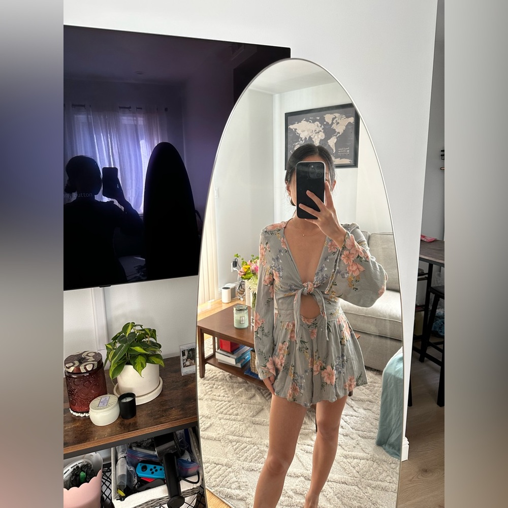 Boho floral long sleeve romper with front tie. Great for summer and spring